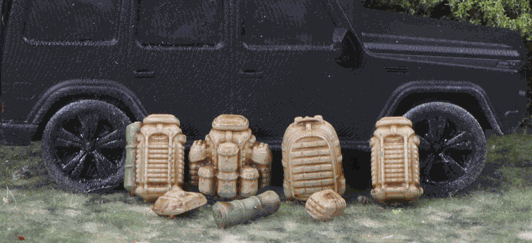 15mm modern backpacks and bedrolls miniature set displayed in front of a black vehicle model