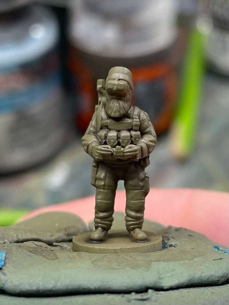 15mm modern resin printed miniature of a Chechen insurgent fighter holding grenades