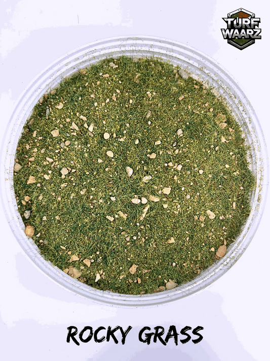 Rocky Grass Wargame Terrain with natural gravels and sands in a clear plastic container for tabletop and miniature modeling projects
