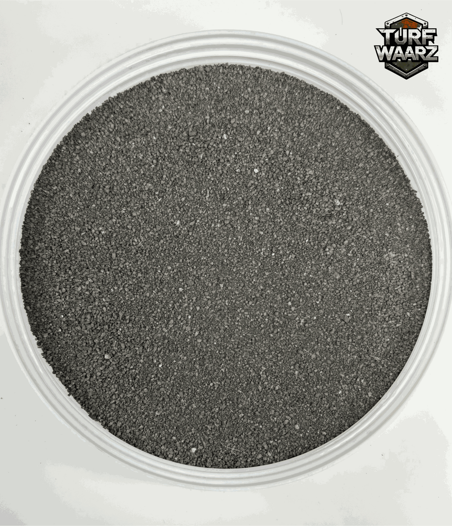Igneous Rock Wargame Terrain textured gravel and sand mixture in a plastic container for tabletop and miniature wargames.