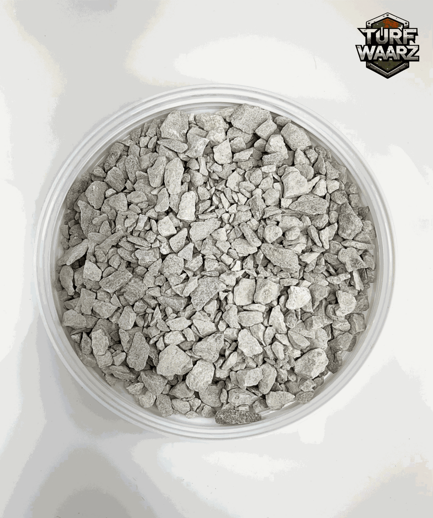 Gray Stones Wargame Terrain with mixed gravels and sands in a clear plastic container for tabletop and miniature wargaming.