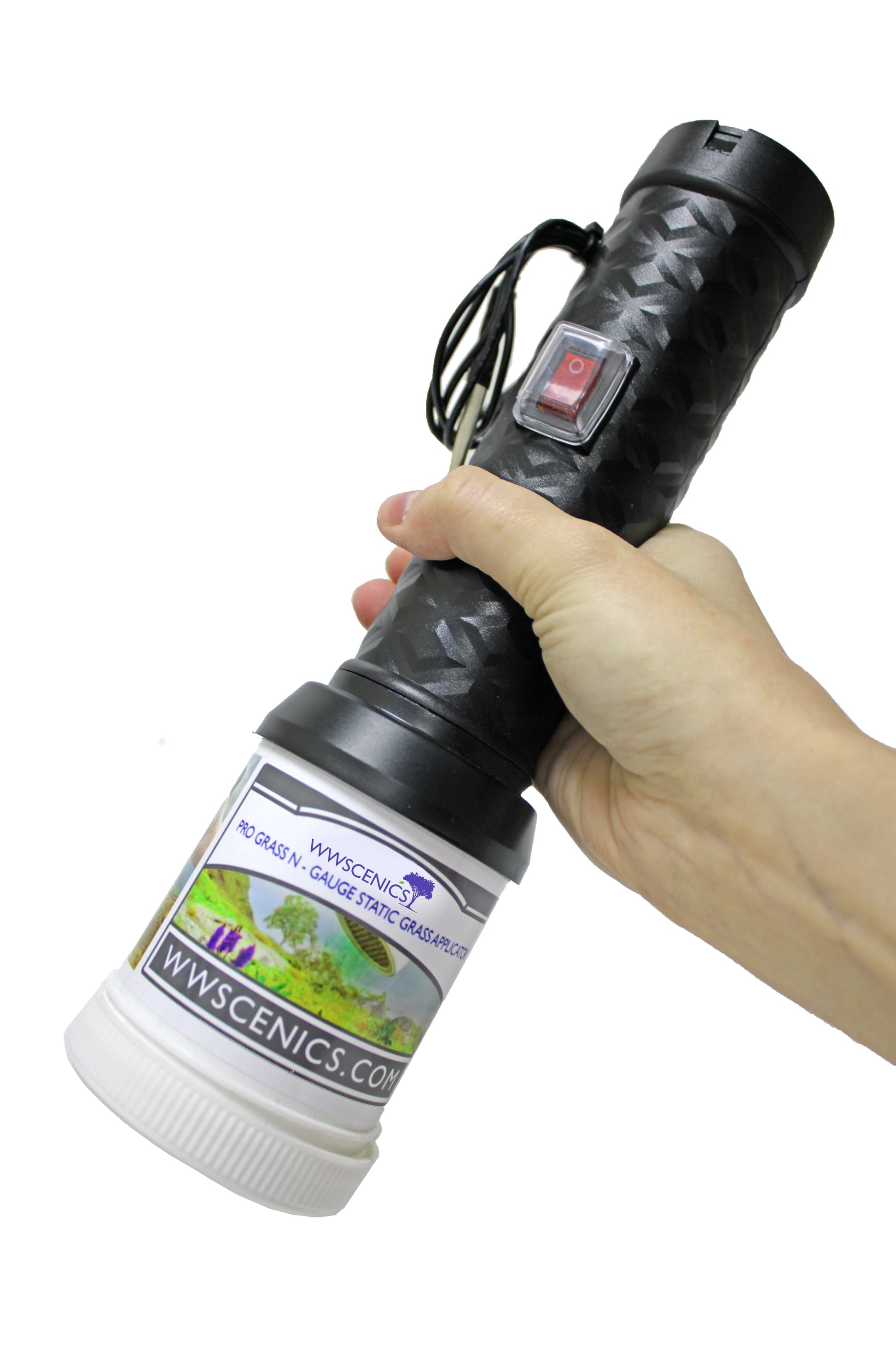 Hand holding WWScenics Pro Grass N Gauge Micro Applicator for static grass application on model landscapes