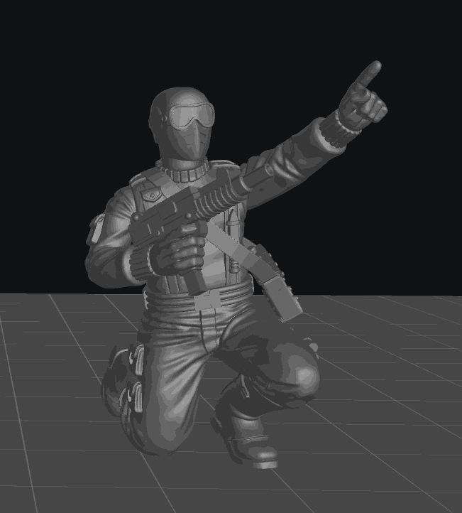 32mm resin model of a kneeling commando with gun and goggles pointing forward