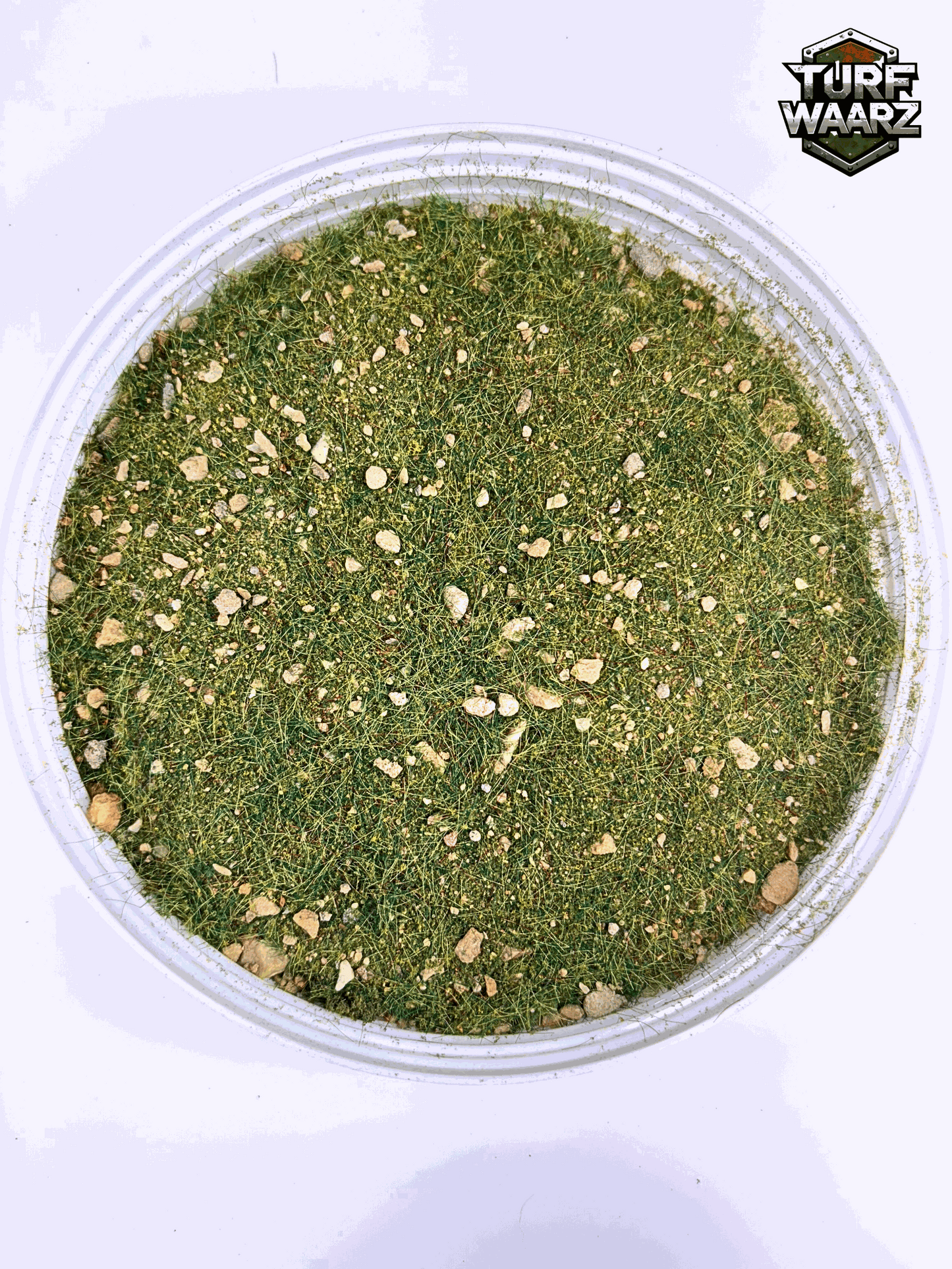 Rocky Grass Wargame Terrain mix of gravels and sand in a clear plastic container for tabletop and miniature wargaming terrain modeling.
