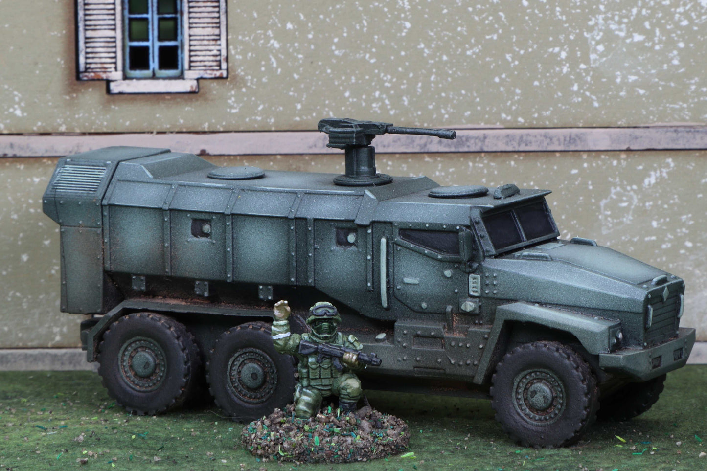 15mm Modern Ural Typhoon MRAP model kit with resin body and parts, displayed with a soldier figure in front of a building facade