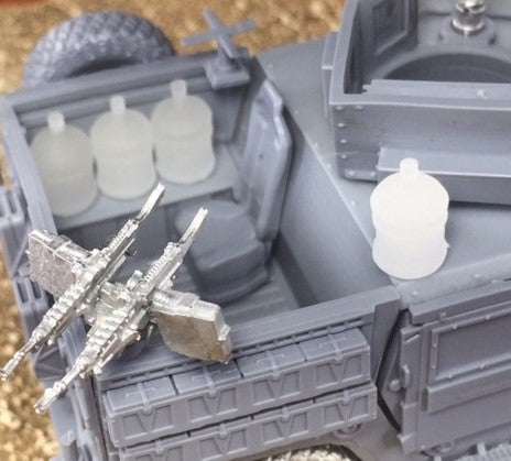 Set of four 28mm 5 gallon water jugs without figures or accessories in a model vehicle setup