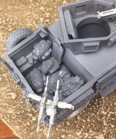 Set of seven 28mm modern utility bags displayed inside a model vehicle compartment.