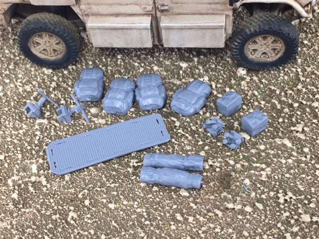 28mm Modern Emergency road side kit with bed rolls, backpacks, back board, smoke dischargers, MRE boxes, and satellite antennas next to vehicle model