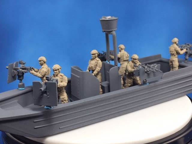 1/50 scale 28mm SOC-R Boat model with six figures and five weapons platforms on a gray boat hull