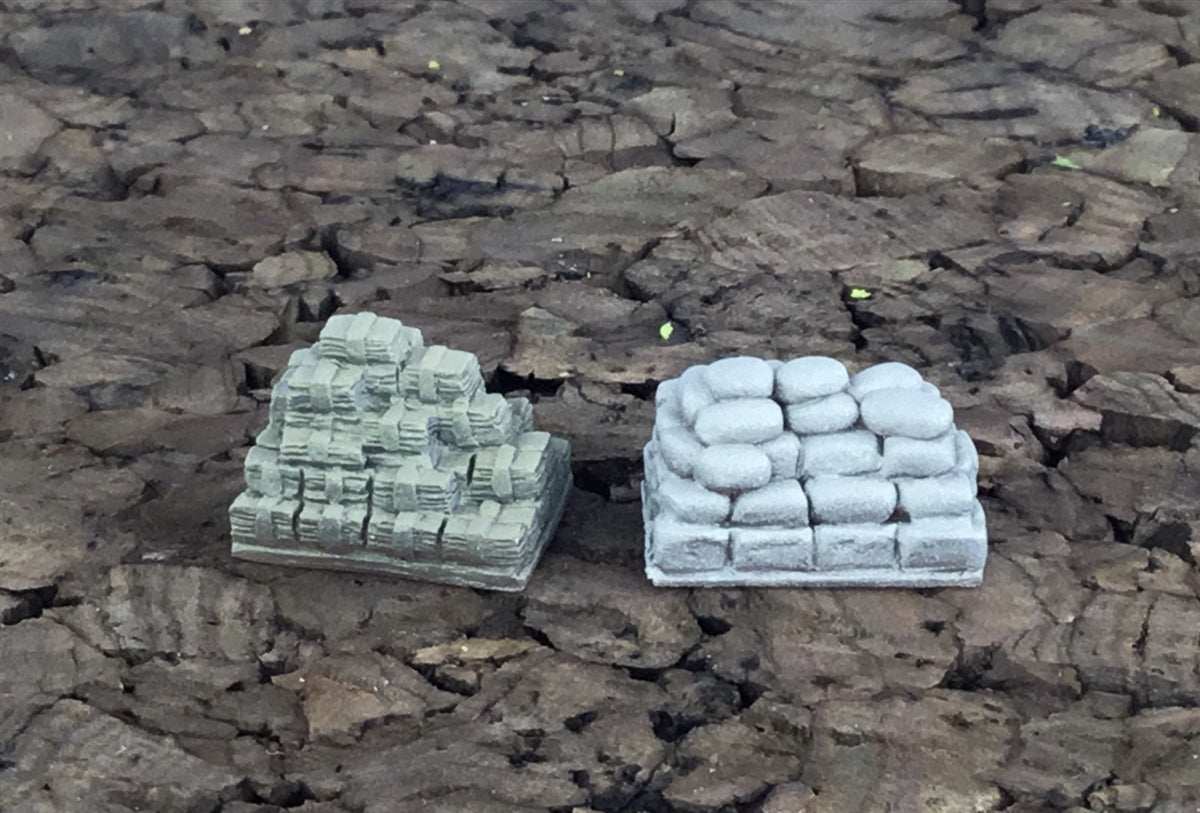 28mm scale miniature set featuring stacks of money and contraband products on cracked ground background