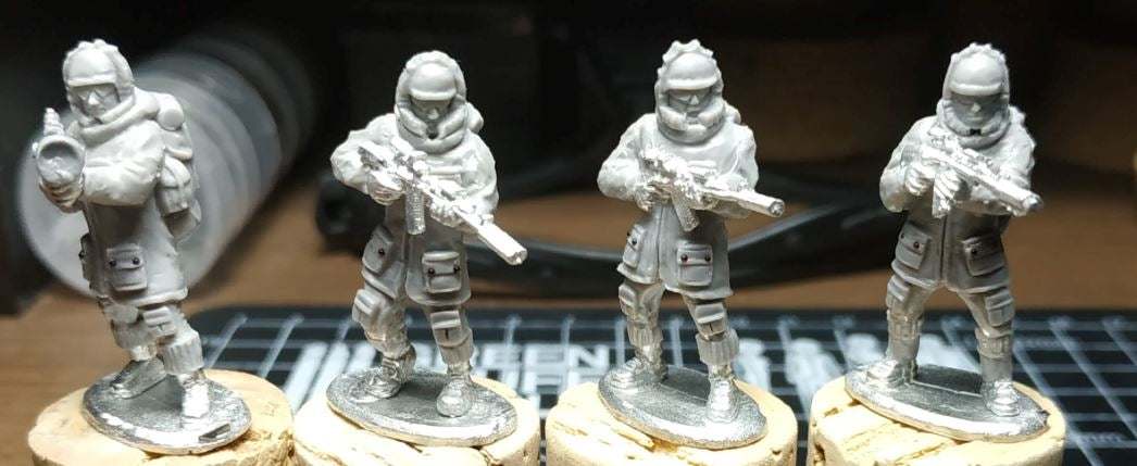 Set of four 28mm Naga Winter Fighters metal miniatures dressed for winter operations holding weapons