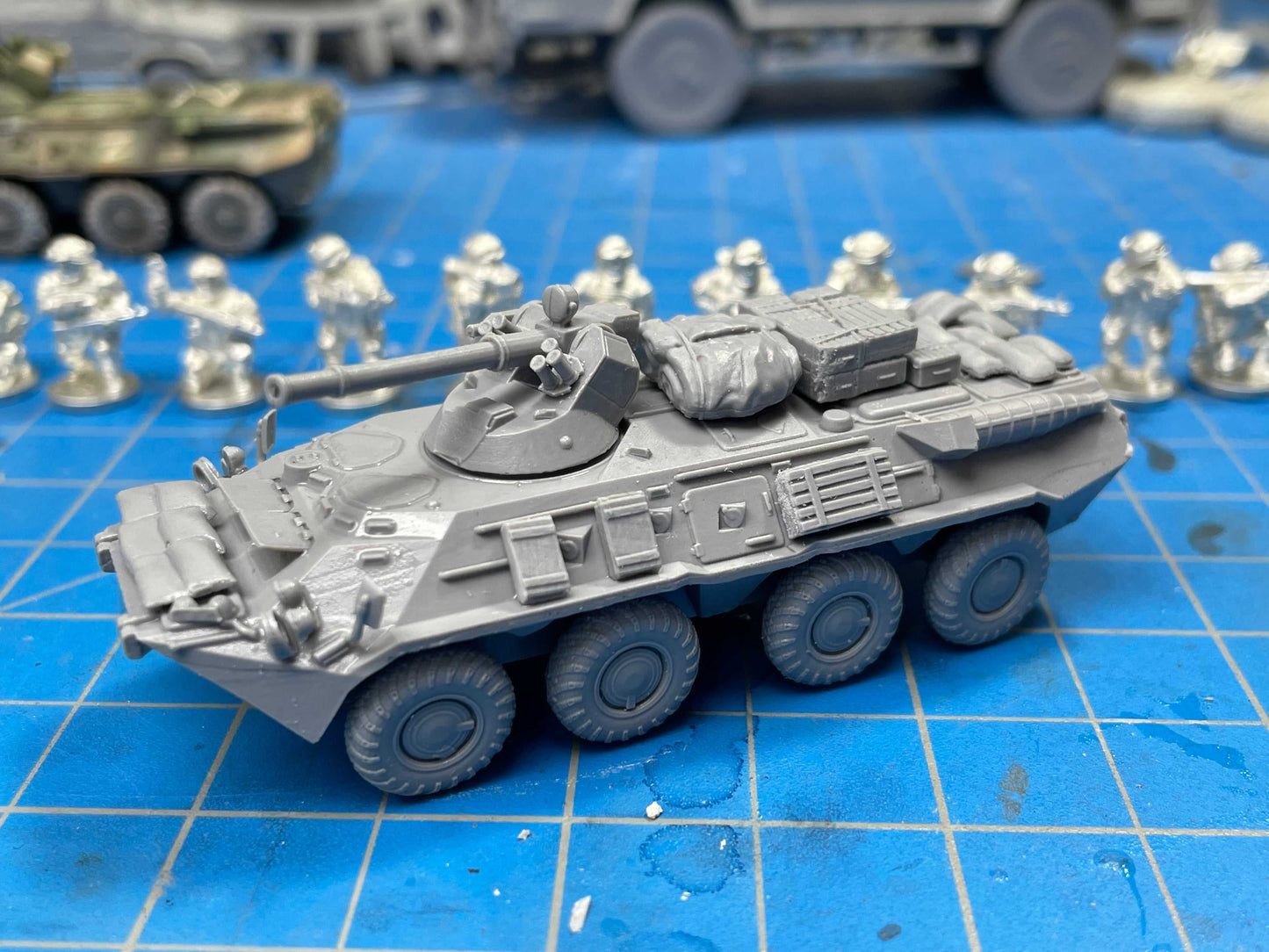 15mm Modern Russian BTR-80/BTR-82 scale model with detailed stowage on blue grid surface