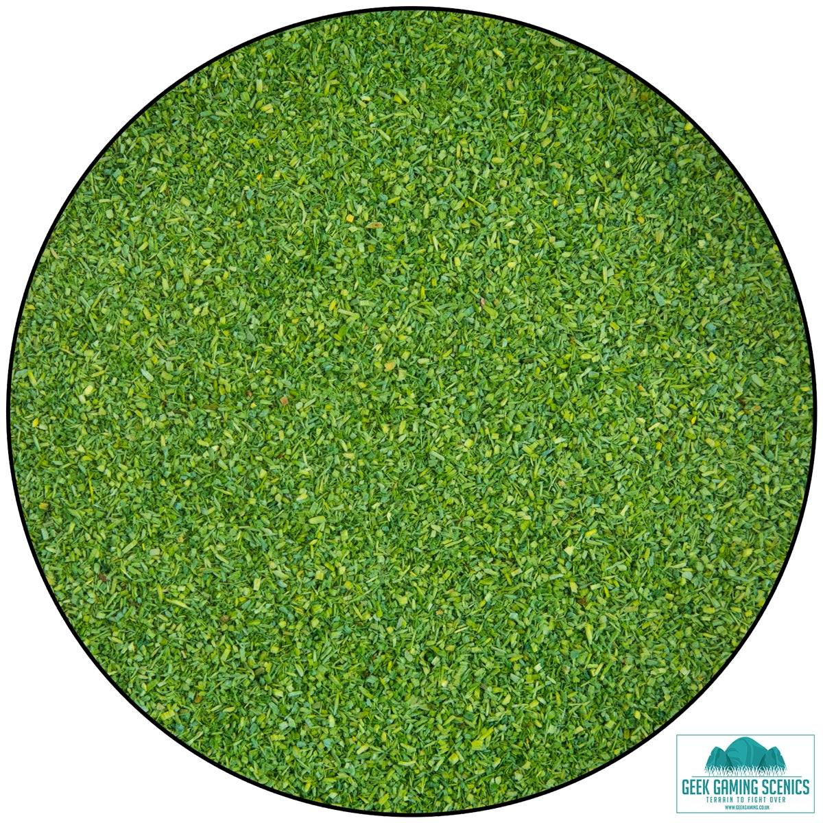 Close-up of green dyed sawdust scatter from Lukes Aps Scatter Dark Meadow, used for realistic ground cover in hobbies like wargaming and model layouts.