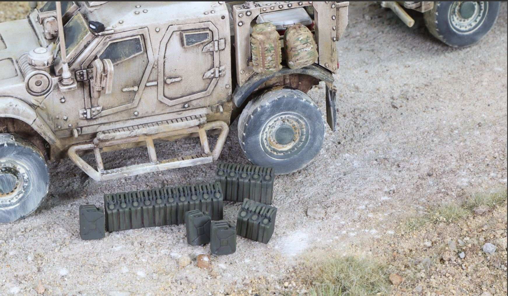 Set of seven 28mm modern jerry cans placed beside a military vehicle model on a sandy terrain