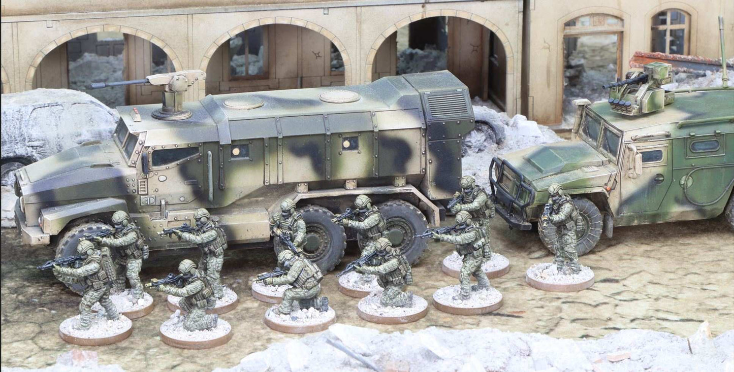 28mm Modern Spetsnaz resin miniatures in combat poses with military vehicles in desert diorama setting
