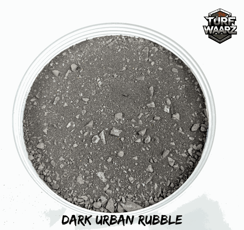 Dark city rubble terrain scatter made of gravel and sand for wargaming and miniature scenery.
