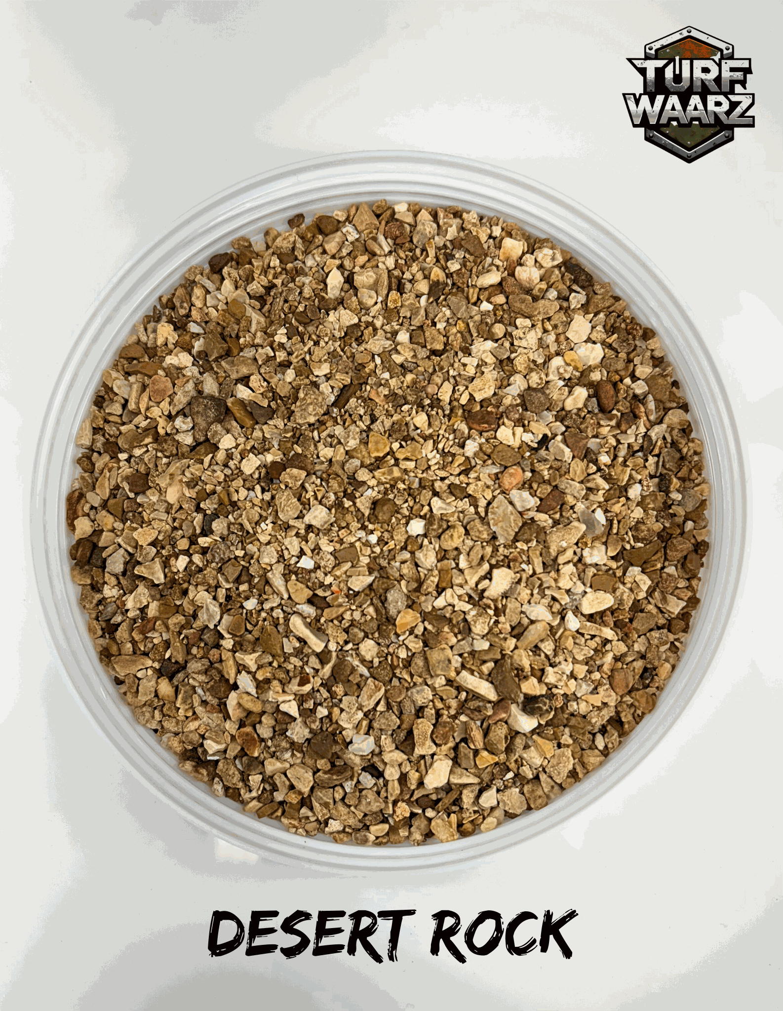 Close-up of Turf Waarz Desert Rock Wargame Terrain gravel and sand mix in a clear plastic container, handcrafted for miniature and tabletop wargaming terrain.