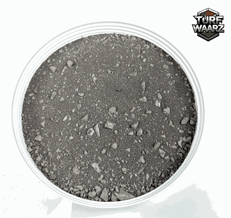 Dark Urban Rubble miniature terrain scatter with gravel and sand for Sci-Fi urban battle scenes in a round plastic container.