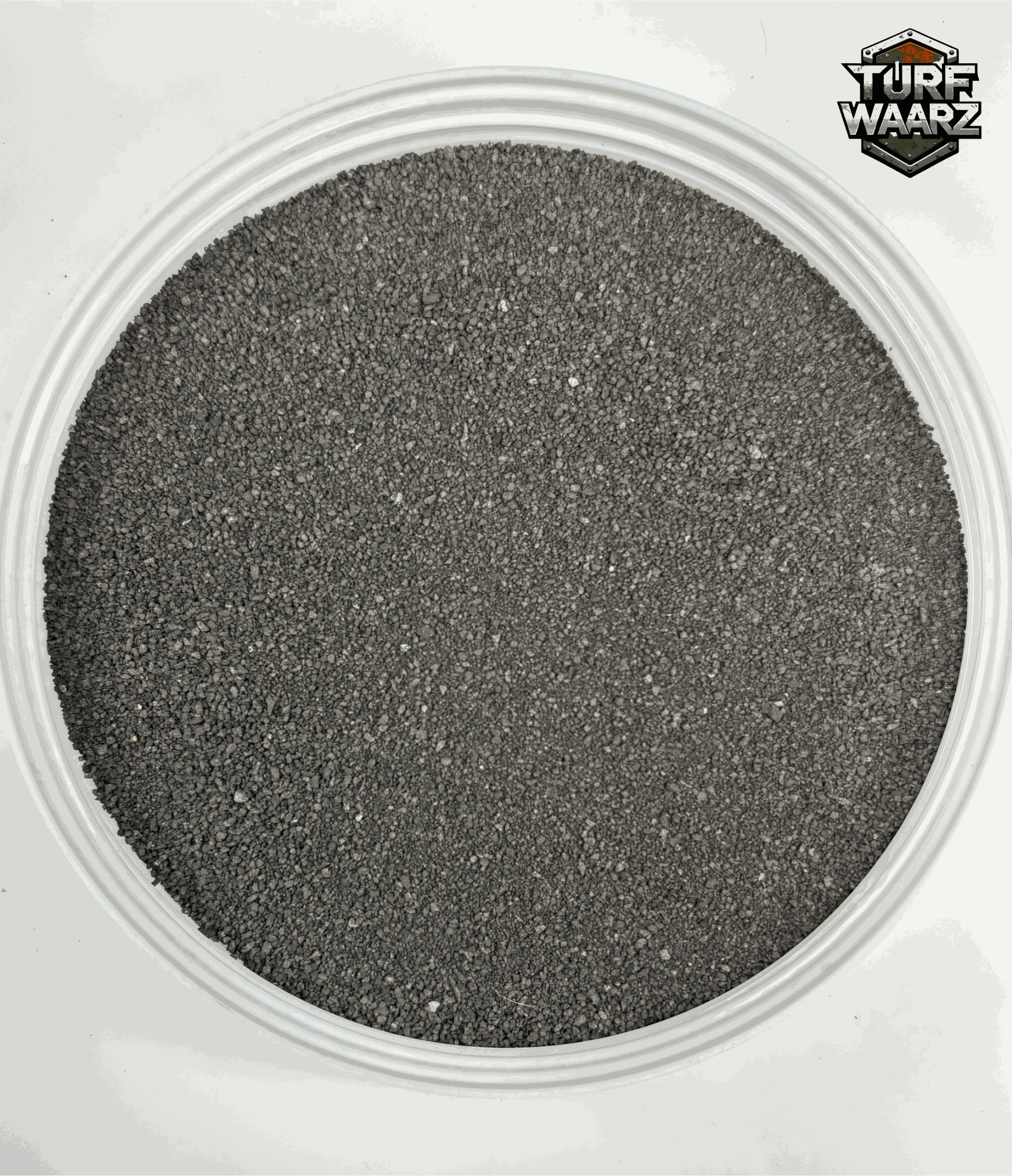 Igneous Rock Wargame Terrain textured gravel and sand mixture in a plastic container for tabletop and miniature wargames.