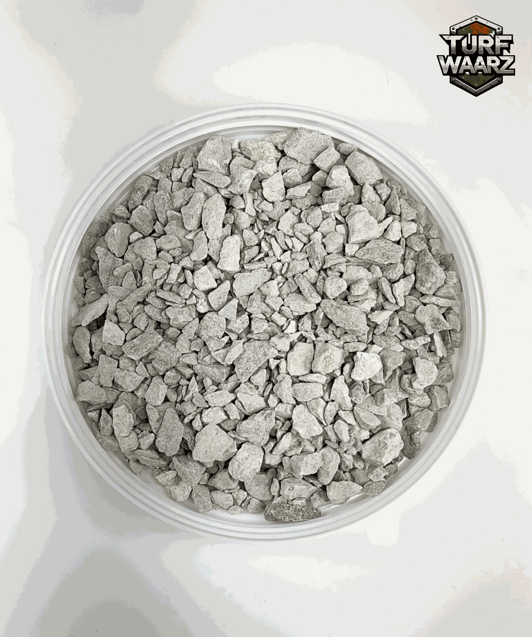 Gray Stones Wargame Terrain with mixed gravels and sands in a clear plastic container for tabletop and miniature wargaming.