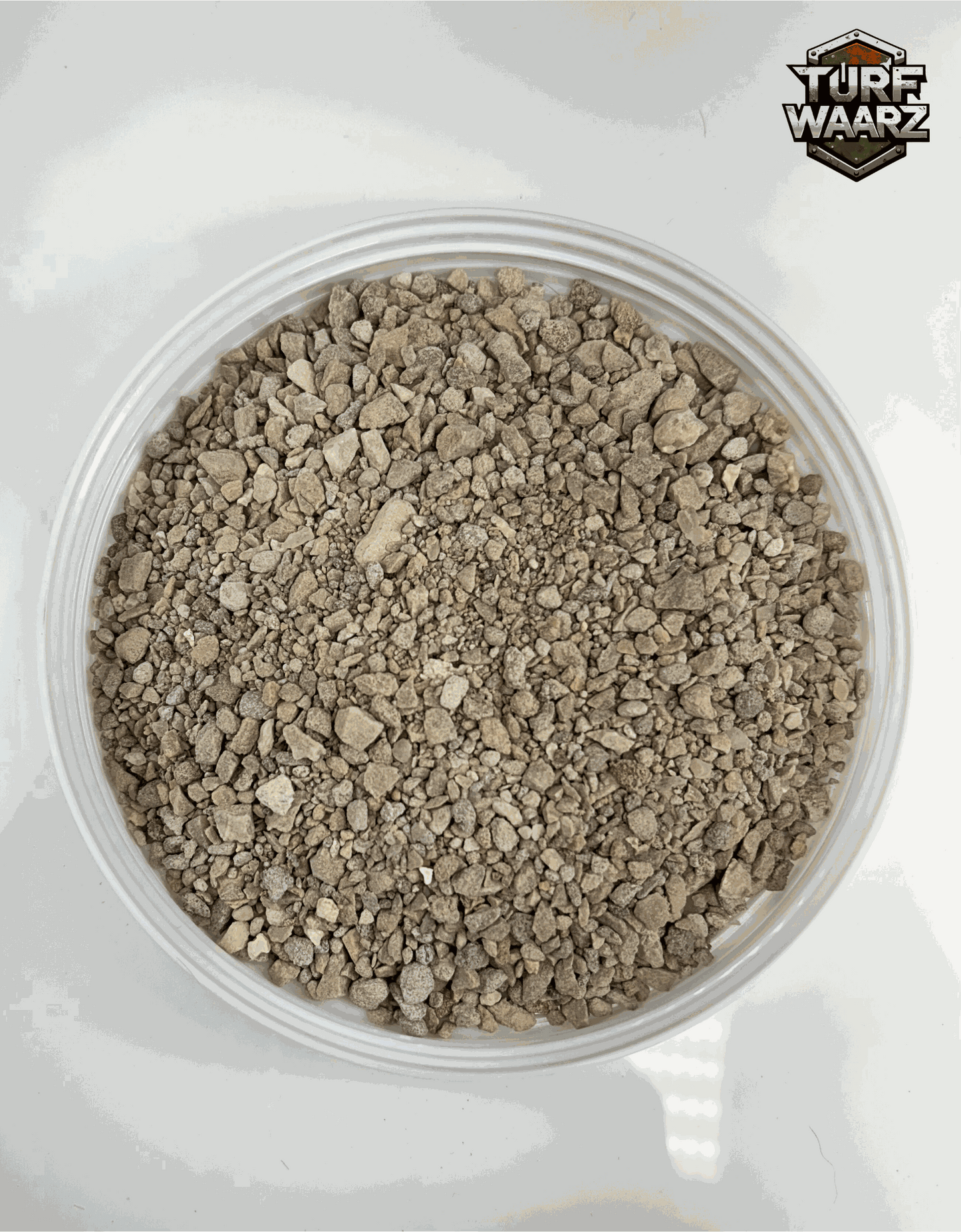 Khaki Stones Wargame Terrain container filled with mixed gravels and sands for miniature modeling.