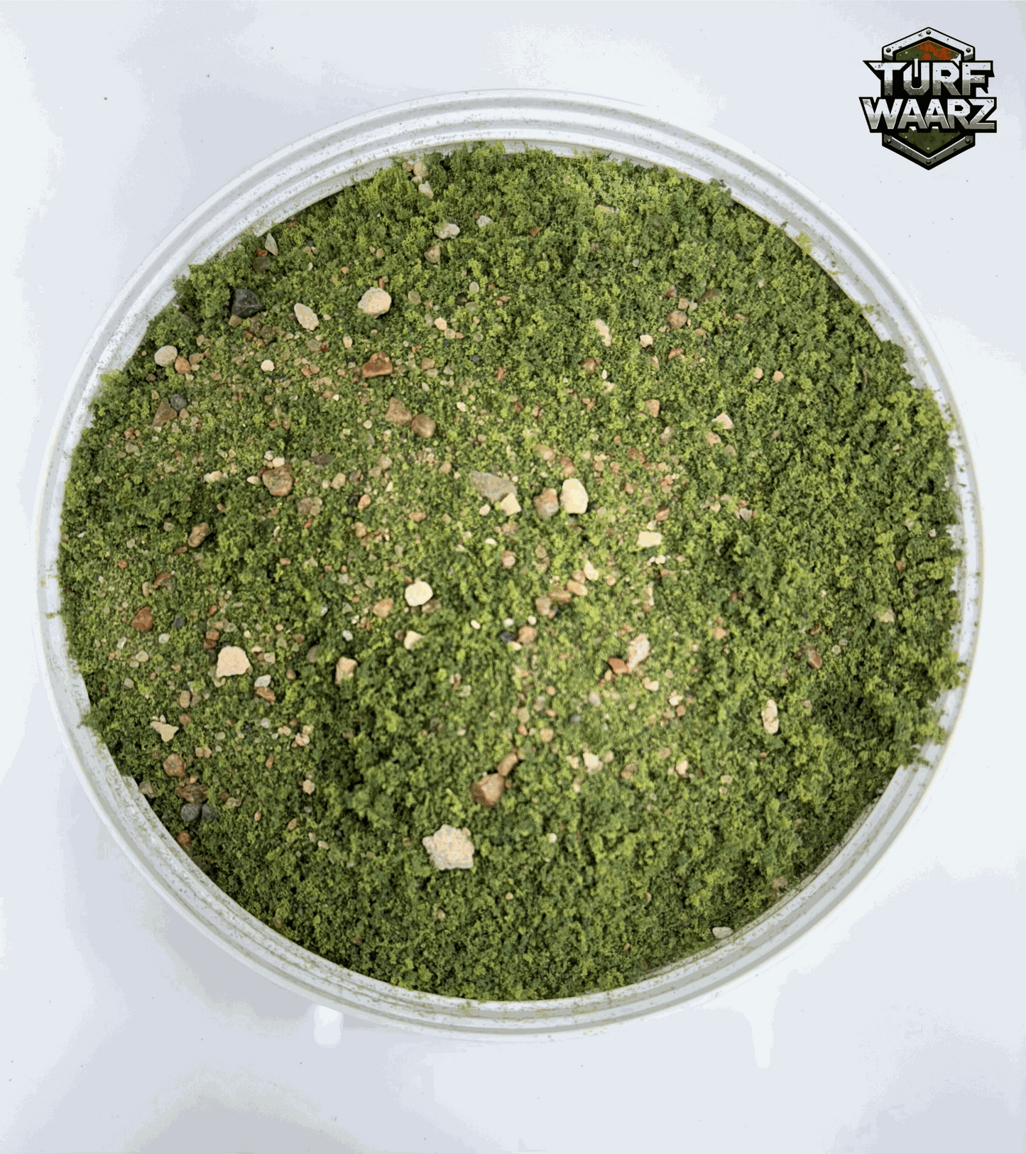 Turf Waarz Greenlands Wargame Turf in a plastic container with mixed gravels, sands, and natural materials for miniature and tabletop wargaming terrain.