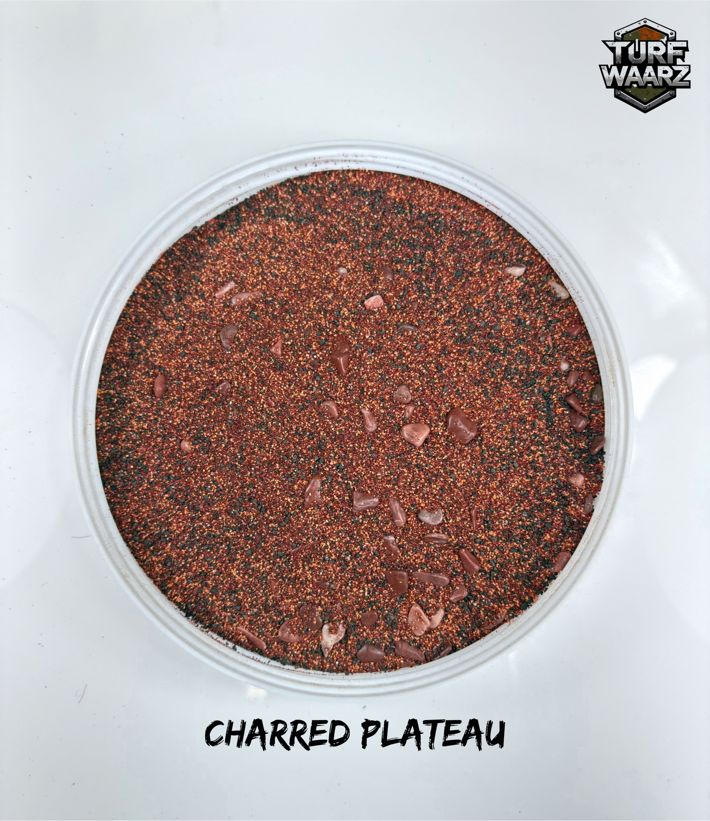 Turf Waarz Charred Plateau textured terrain material for tabletop and miniature wargames in a clear plastic container