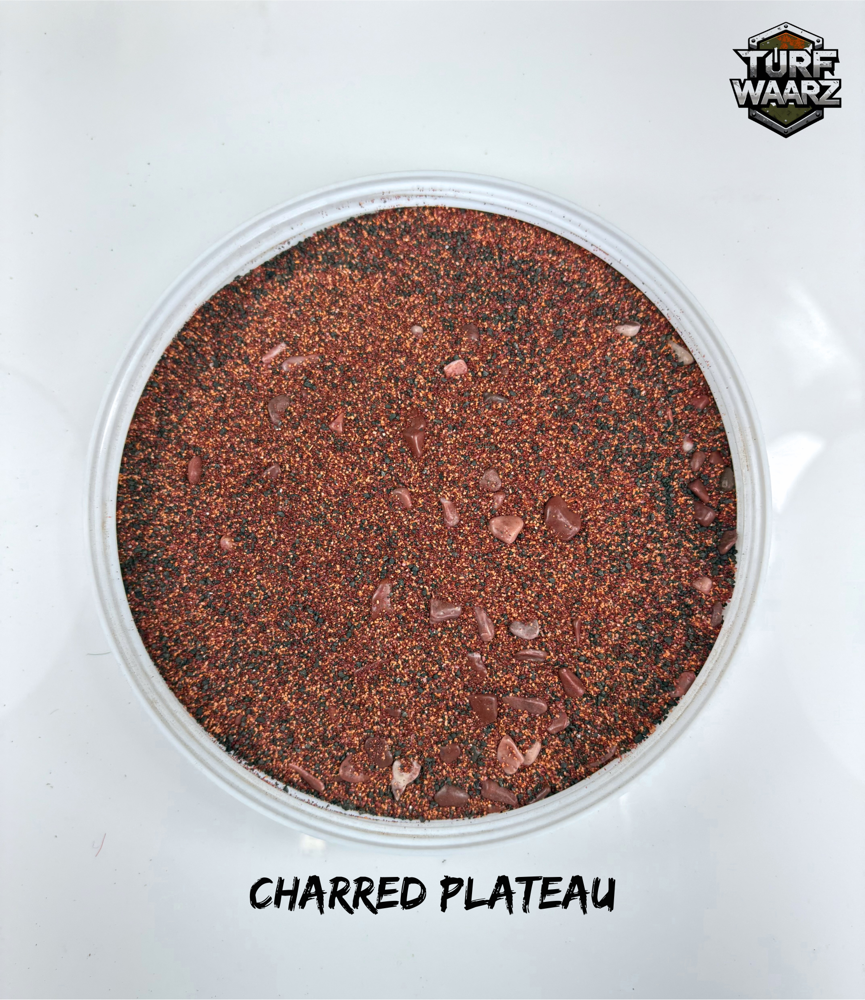 Turf Waarz Charred Plateau textured terrain material for tabletop and miniature wargames in a clear plastic container