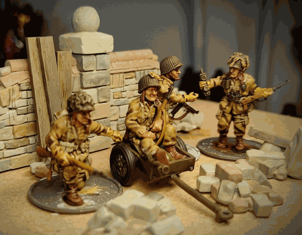 28mm WW2 US airborne colonel and HQ miniatures set with wounded officer and armed soldiers around broken wall terrain