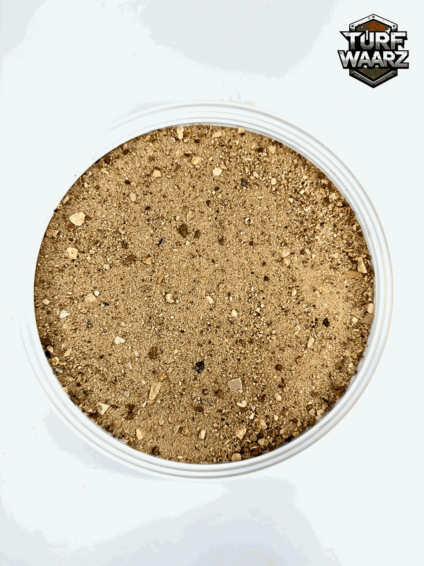 Desert Wargame Terrain with natural gravel and sand mix in a plastic container for tabletop and miniature wargaming.