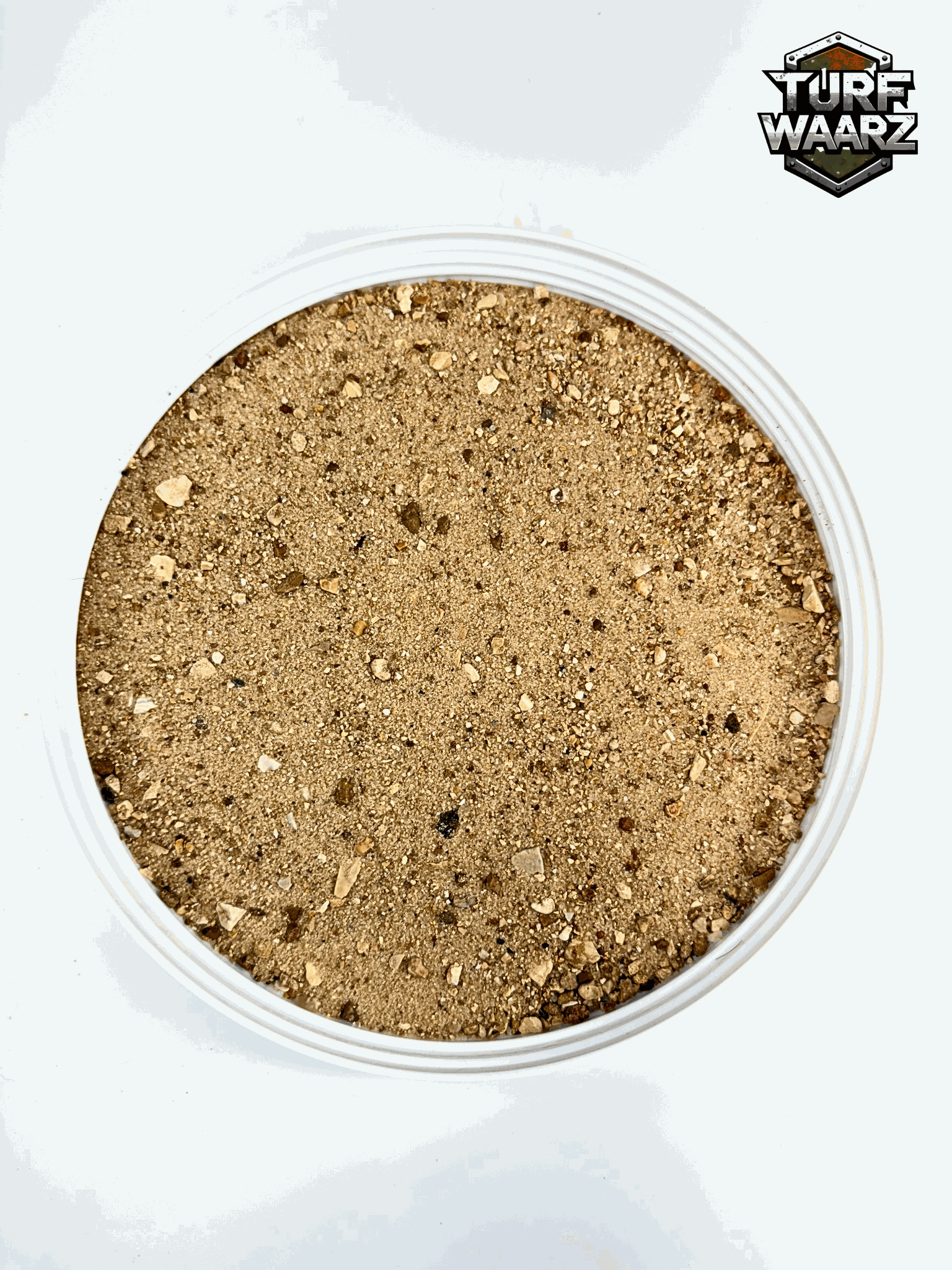 Desert Wargame Terrain with natural gravel and sand mix in a plastic container for tabletop and miniature wargaming.