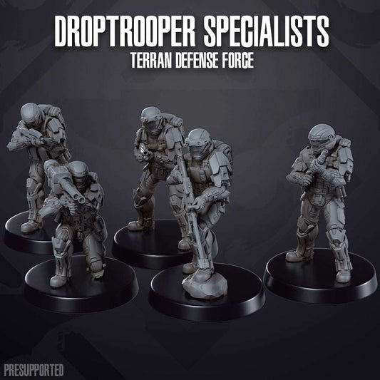 Seven 32mm resin printed Droptrooper Specialists miniatures from Terran Defense Force, unpainted and detailed.
