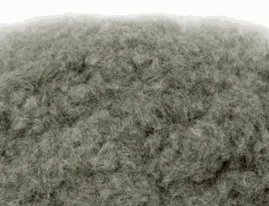 Close-up of WWScenics 2mm Melting Snow static grass fibers for miniature winter terrain modeling